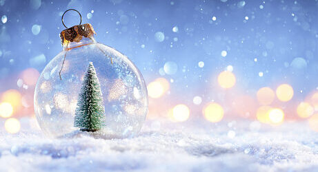 Snow Globe With Christmas Tree In It And Bokeh On Winter Background